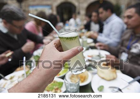 Stock Image - Glass Of Lemon And Mint Drink, Haret Jdoudna, Madaba, Jordan, Middle East. Fotosearch