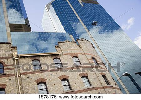 Glass Skyscraper And Brick Building View Large Photo Image Stock Photograph - Glass Skyscraper And Brick Building. Fotosearch