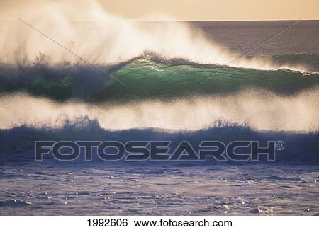 Stock Photograph - Glassy Wave Curling Over At Sunset With White Wash, View From Shore. Fotosearch
