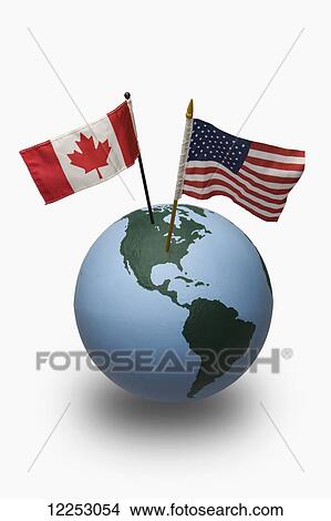 Picture - Globe with American and Canadian flag. Fotosearch