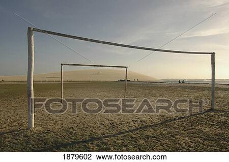 Stock Image - Goalposts On Empty Football Pitch. Fotosearch