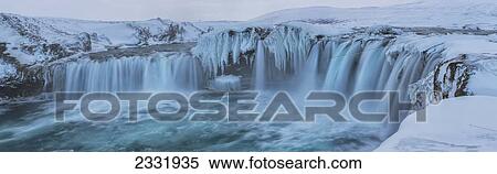 Stock Photography - Godafoss With Large Pieces Of Ice Forming In The Cold Weather; Iceland. Fotosearch
