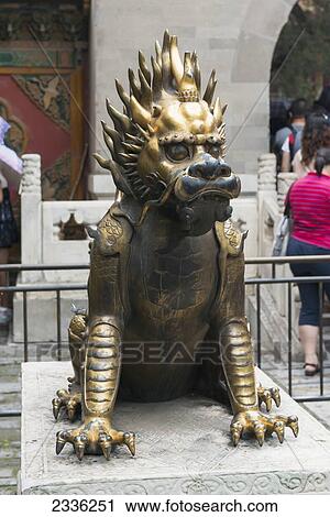 Stock Image - Gold And Black Statue Of A Ferocious Looking Animal; Beijing, China. Fotosearch