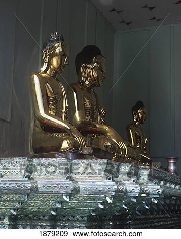 Gold Buddha Statues View Large Photo Image Stock Photo - Gold Buddha Statues. Fotosearch