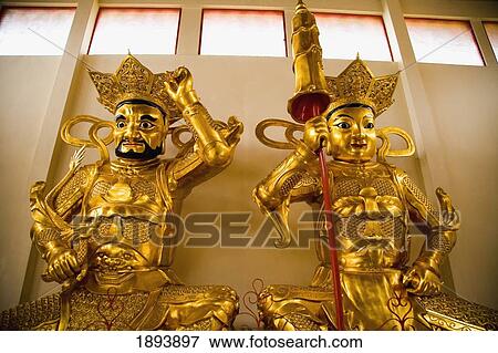 Stock Photo - Gold Buddhist Statues Inside Sam Poh Temple. Fotosearch