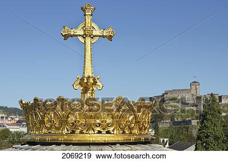 Gold Crown With Cross On Top Of The Cathedral Dome With Castle In Background Sanctuary Of Our Lady Of Lourdes; Lourdes Hautes-Pyrenees France View Large Photo Image Stock Photo - Gold Crown With Cross On Top Of The Cathedral Dome With Castle In Background Sanctuary Of Our Lady Of Lourdes; Lourdes Hautes-Pyrenees France. Fotosearch