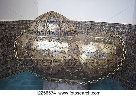 Picture - Gold-inlaid steel Dervish begging bowl (kash-kul), Shrine of Nematullah Vali Kermani; Mahan, Iran. Fotosearch