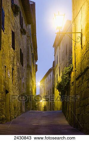 Golden light illuminates walls of old buildings; Pienza, Tuscany, Italy View Large Photo Image Stock Image - Golden light illuminates walls of old buildings; Pienza, Tuscany, Italy. Fotosearch