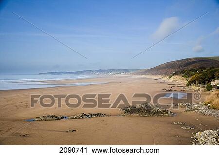 Golden Sands And Rocks On The Beach In Putsborough Sands, North Devon, Uk View Large Photo Image Stock Image - Golden Sands And Rocks On The Beach In Putsborough Sands, North Devon, Uk. Fotosearch