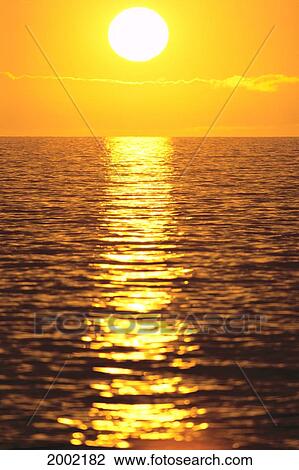 Golden Sunset Over Ocean Water, Reflection On Shimmering Water View Large Photo Image Stock Image - Golden Sunset Over Ocean Water, Reflection On Shimmering Water. Fotosearch
