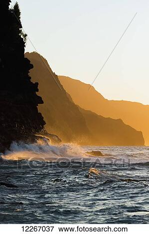 Golden waves looking down the Na Pali Coast; Wainiha, Kauai, Hawaii, United States of America View Large Photo Image Stock Photo - Golden waves looking down the Na Pali Coast; Wainiha, Kauai, Hawaii, United States of America. Fotosearch