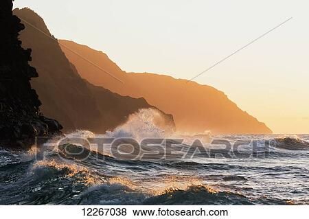 Stock Photo - Golden waves looking down the Na Pali Coast; Wainiha, Kauai, Hawaii, United States of America. Fotosearch