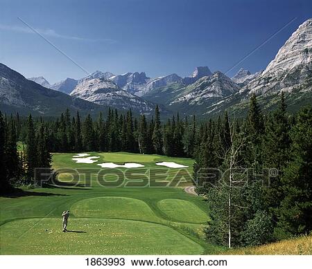 Stock Image - Golfing In The Rocky Mountains, Kananaskis, Alberta, Canada. Fotosearch