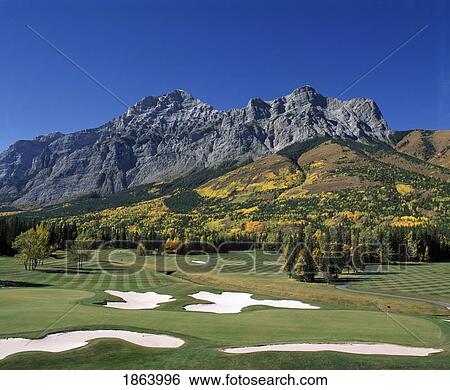 Stock Photograph - Golfing In The Rocky Mountains; Kananaskis, Alberta, Canada. Fotosearch
