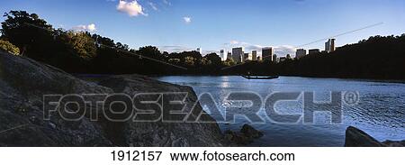 Gondola Floating On Pond In Central Park, Manhattan, New York City, New York State, Usa View Large Photo Image Stock Photo - Gondola Floating On Pond In Central Park, Manhattan, New York City, New York State, Usa. Fotosearch