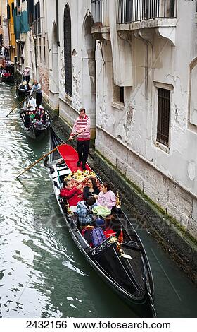 Gondola in a canal; Venice, Italy View Large Photo Image Stock Photograph - Gondola in a canal; Venice, Italy. Fotosearch