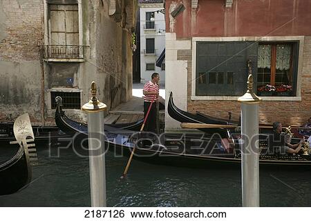 Stock Photograph - Gondola On Canal Venice Italy Chris Caldicott. Fotosearch