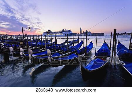 Stock Image - Gondolas, Cruise Ship And San Giorgio Maggiore Church At Dawn; Venice, Italy. Fotosearch