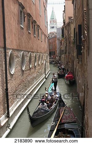 Stock Image - Gondola's In Narrow Canal, Venice, Italy.. Fotosearch