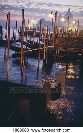 Gondolas In The Lagoon With Santa Maria Della Salute Behind At Dusk View Large Photo Image Stock Image - Gondolas In The Lagoon With Santa Maria Della Salute Behind At Dusk. Fotosearch