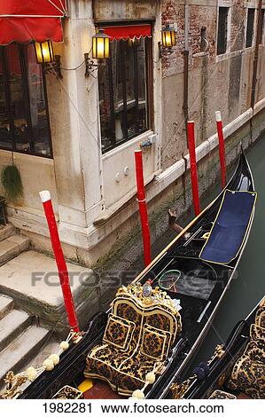 Gondolas Moored In A Canal Beside A Restaurant; Venice Veneto Italy View Large Photo Image Stock Image - Gondolas Moored In A Canal Beside A Restaurant; Venice Veneto Italy. Fotosearch