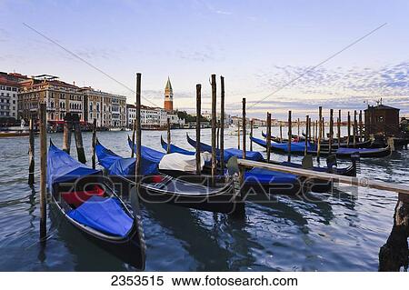 Stock Photography - Gondolas Mooring In The Water At Sunrise; Venice, Italy. Fotosearch