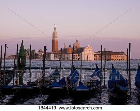 Gondolas On Canal, Church Of St. Giorgio Maggiore In Background; Grand Canal, Venice, Italy View Large Photo Image Stock Photo - Gondolas On Canal, Church Of St. Giorgio Maggiore In Background; Grand Canal, Venice, Italy. Fotosearch