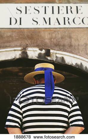Stock Photo - Gondolier Going Under Bridge. Fotosearch