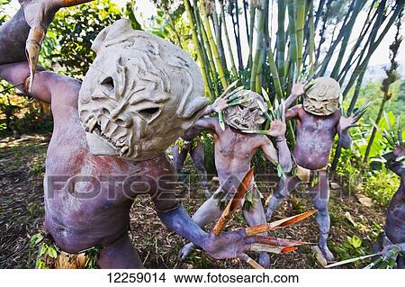 Picture - Goroka Mudmen dressed in traditional costume; Goroka, Eastern Highlands, Goroka. Fotosearch