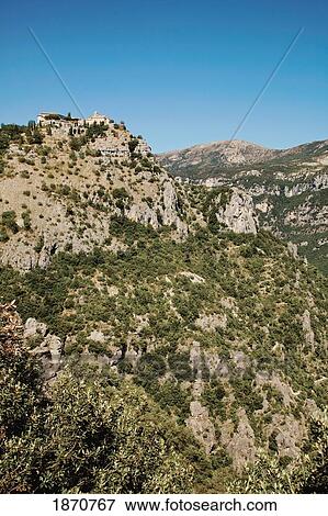 Stock Photo - Gourdon, Provence, France; Houses At The Top Of A Mountainous Landscape. Fotosearch