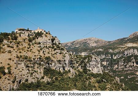 Stock Photograph - Gourdon, Provence, France; Houses At The Top Of A Mountainous Landscape. Fotosearch