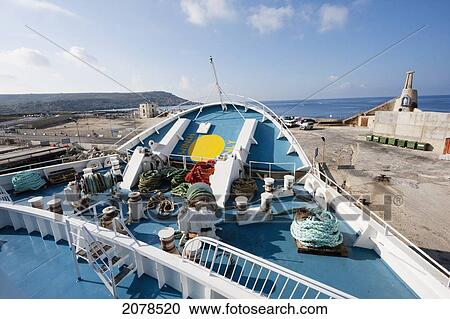 Stock Image - Gozo Channel Line Ferry Approaching The Harbour, Cirkewwa, Malta. Fotosearch