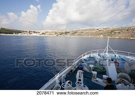Stock Image - Gozo Ferry Approaching Mgarr, Gozo Island, Malta. Fotosearch