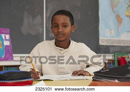 Grade 6 Boy In Classroom, Toronto, Ontario, Canada View Large Photo Image Stock Image - Grade 6 Boy In Classroom, Toronto, Ontario, Canada. Fotosearch