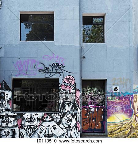 Stock Image - Graffiti and artwork painted on building; Santiago, Santiago Metropolitan Region, Chile. Fotosearch