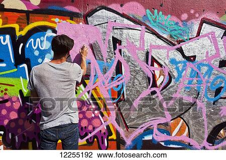 Stock Image - Graffiti art in the Leake Street Graffiti tunnel; London, England. Fotosearch