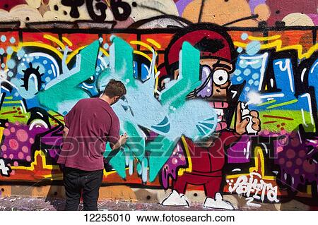 Graffiti artist in the Leake Street Graffiti tunnel; London, England View Large Photo Image Stock Image - Graffiti artist in the Leake Street Graffiti tunnel; London, England. Fotosearch