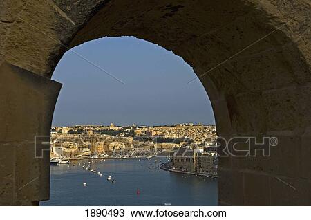 Stock Image - Grand Harbor Through Stone Arch. Fotosearch