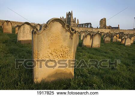 Stock Photography - Graveyard Of St Mary The Virgin Church With Ruins Of St Hildas Abbey In Background. Fotosearch