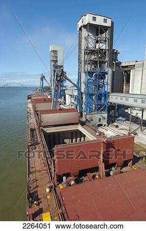 Stock Image - Great Lakes Ship Unloading Grain; Trois Rivieres Quebec Canada. Fotosearch