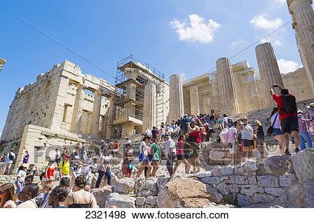 Stock Photo - Greece, Athens, Tourists Walking Around The Historic Ruins Of The Parthenon.. Fotosearch