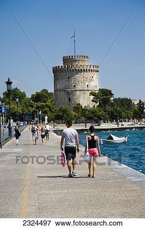 Greece, Couple walking towards White Tower; Thessaloniki View Large Photo Image Stock Photo - Greece, Couple walking towards White Tower; Thessaloniki. Fotosearch