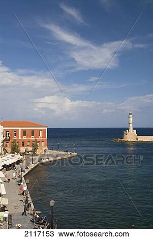 Greece, Crete, 16th Century Venetian Harbor and lighthouse, People enjoying the afternoon. View Large Photo Image Stock Image - Greece, Crete, 16th Century Venetian Harbor and lighthouse, People enjoying the afternoon.. Fotosearch