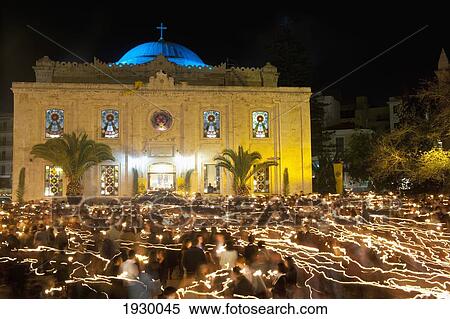 Stock Photography - Greece, Crete, Easter Morning Outside Aigos Titos Church; Heraklion / Iraklio, People with Lit Candles. Fotosearch