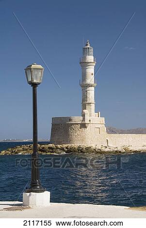Greece, Crete, Hania, Architectural detail of a street light and lighthouse. View Large Photo Image Stock Photography - Greece, Crete, Hania, Architectural detail of a street light and lighthouse.. Fotosearch