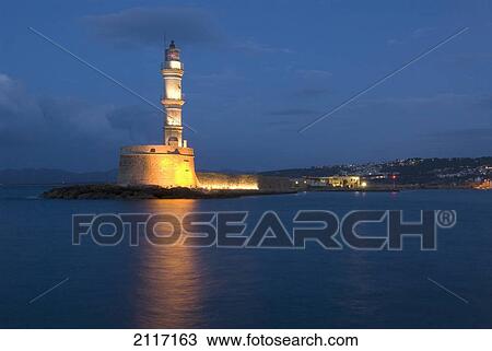 Greece, Crete, Hania, Old lighthouse in the evening, lights reflecting on water. View Large Photo Image Stock Image - Greece, Crete, Hania, Old lighthouse in the evening, lights reflecting on water.. Fotosearch
