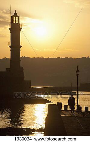 Greece, Crete, Hania, Silhouette of Old Lady in Chania Harbor; Chania View Large Photo Image Picture - Greece, Crete, Hania, Silhouette of Old Lady in Chania Harbor; Chania. Fotosearch
