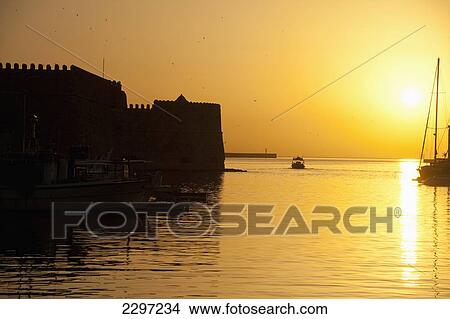 Greece, Crete, harbor and Venetian Fortress at dawn; Heraklion (Iraklion), Fishing boat View Large Photo Image Picture - Greece, Crete, harbor and Venetian Fortress at dawn; Heraklion (Iraklion), Fishing boat. Fotosearch