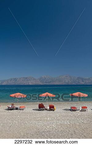 Greece, Crete, Kitro Platia beach with Orno mountains across Gulf of Mirabello; Agios Nikolaos View Large Photo Image Stock Image - Greece, Crete, Kitro Platia beach with Orno mountains across Gulf of Mirabello; Agios Nikolaos. Fotosearch