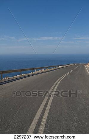 Greece, Crete, Road going beside sea; Chora Sfakion View Large Photo Image Stock Photo - Greece, Crete, Road going beside sea; Chora Sfakion. Fotosearch